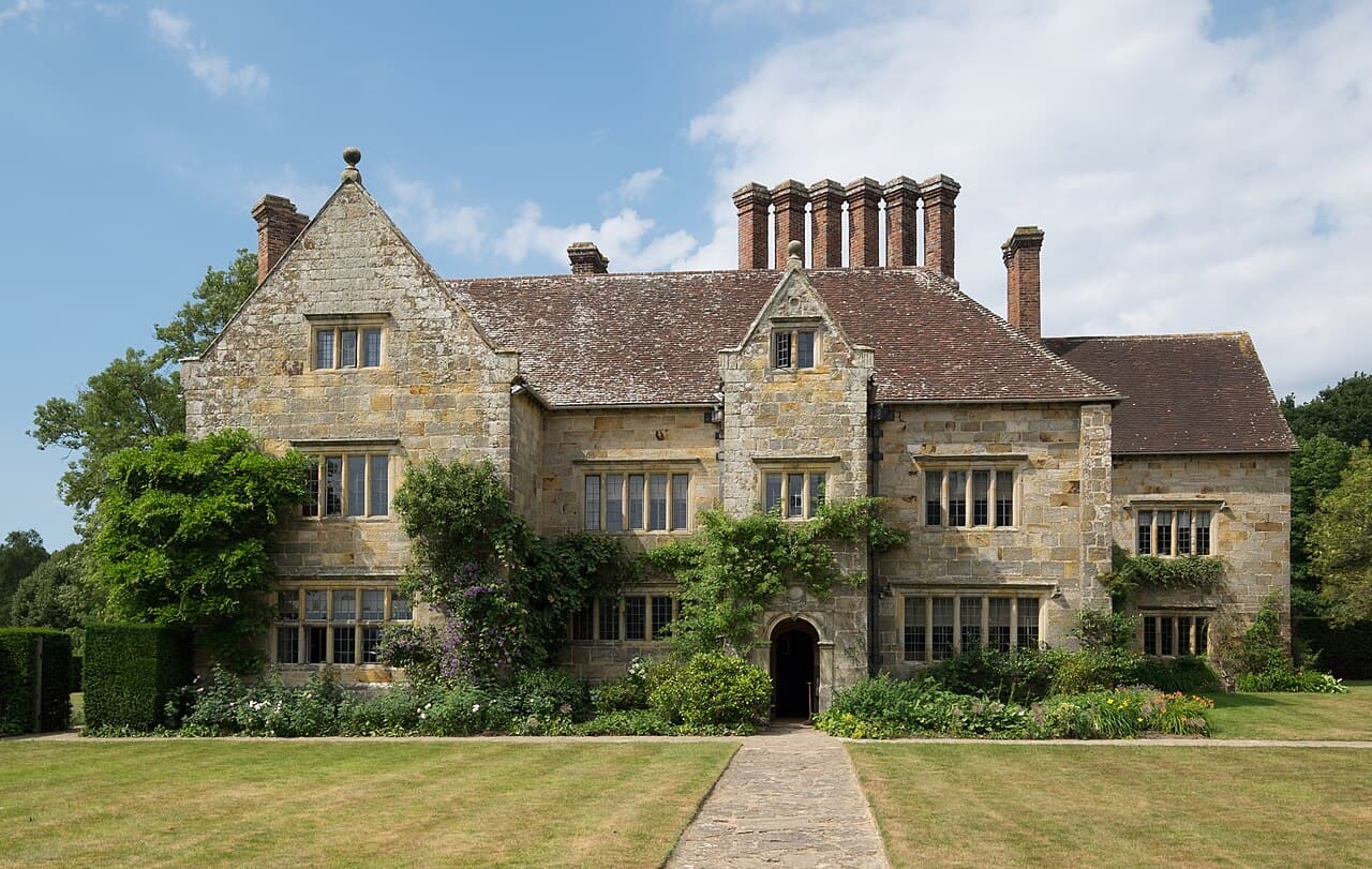 Bateman's, Rudyard Kipling's 17th-century sandstone house in Burwash, with tall chimneys and a path across the lawn to the front door